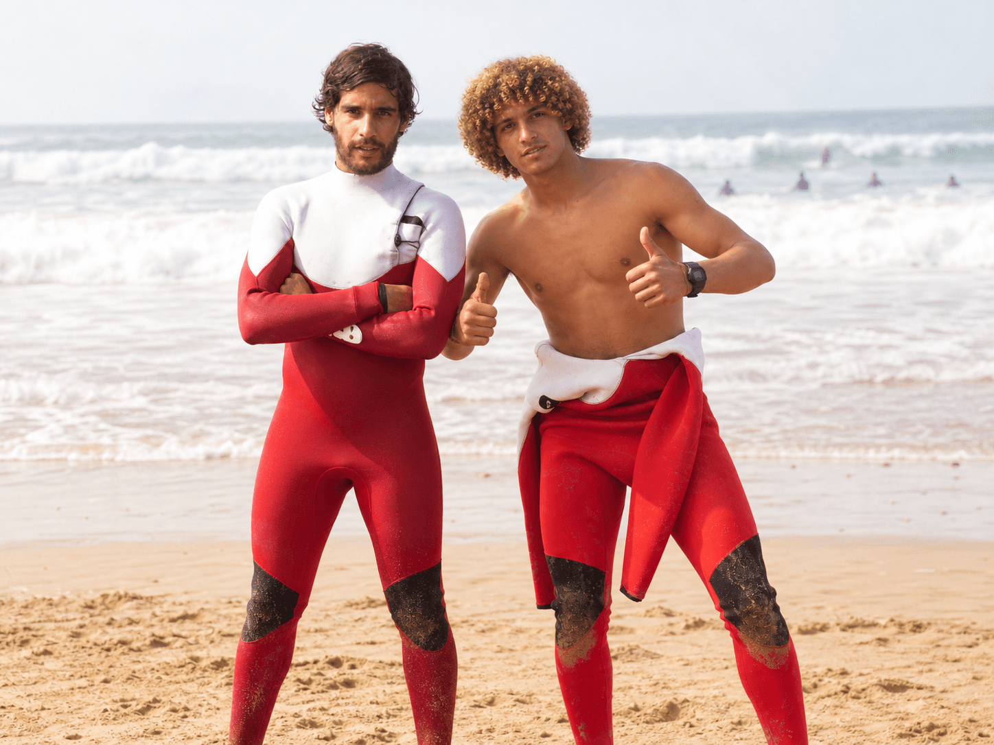 Salah and Younes standing together on the beach